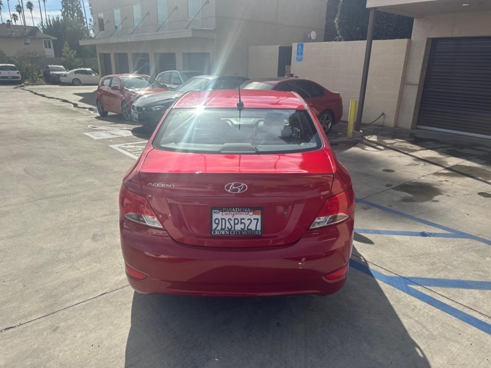 2015 Red /Gray Hyundai Accent GLS Sedan 4D (KMHCT4AE2FU) with an 4-Cyl, 1.6L engine, Auto, 6-Spd w/Overdrive transmission, located at 30 S. Berkeley Avenue, Pasadena, CA, 91107, (626) 248-7567, 34.145447, -118.109398 - The 2015 Hyundai Accent 4-Door Sedan stands as a testament to Hyundai's commitment to quality, efficiency, and value. Located in Pasadena, CA, our dealership specializes in providing a wide range of used BHPH (Buy Here Pay Here) cars, trucks, SUVs, and vans, including the remarkable Hyundai Accent. - Photo #4